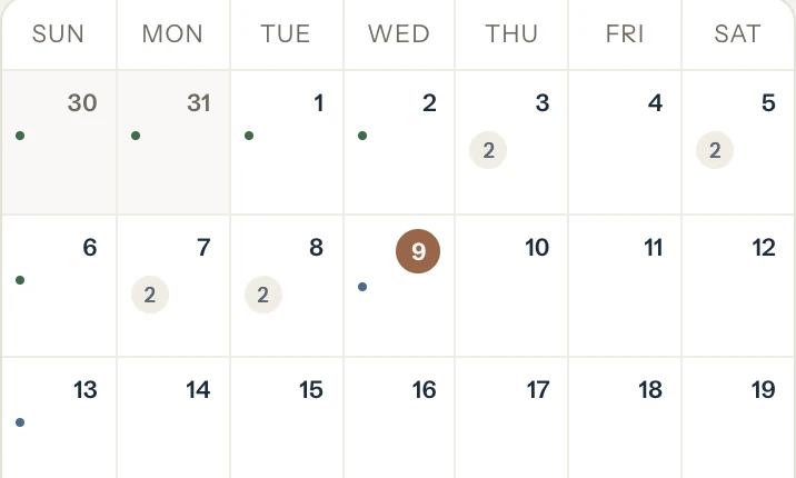 The calendar's month view on a phone, with booked days marked and today highlighted