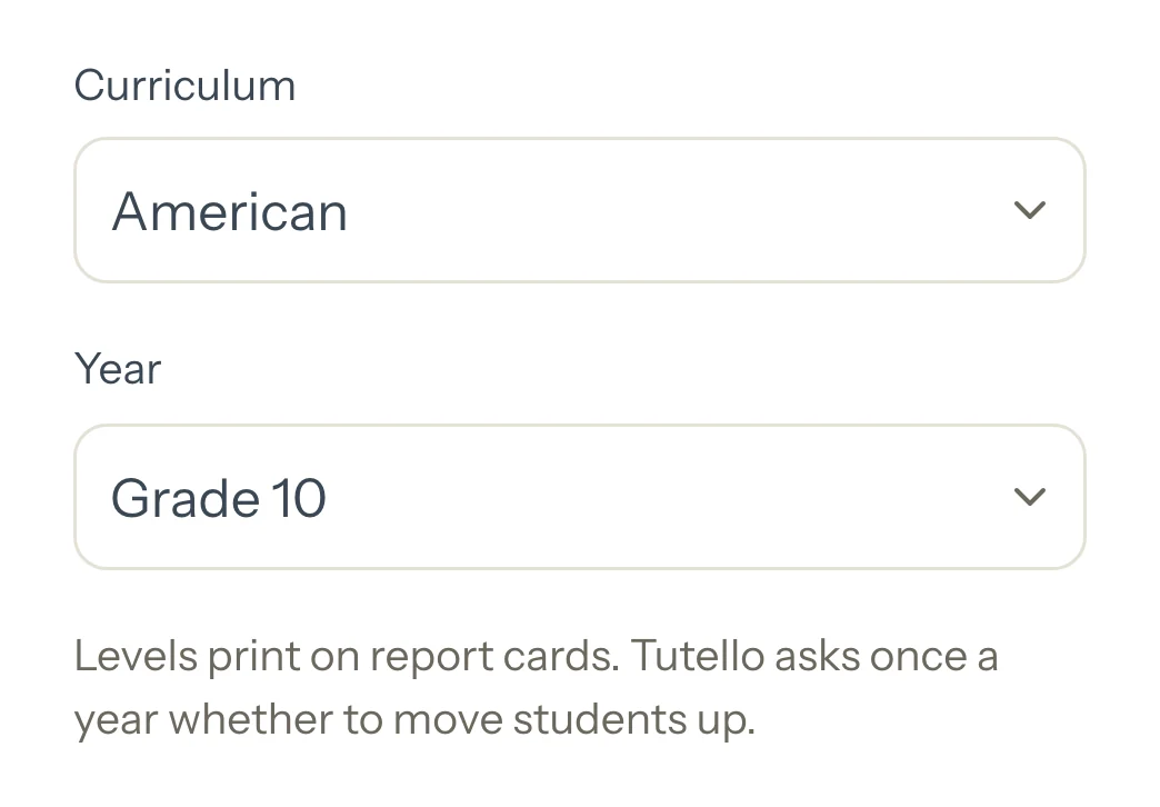 A student's Details with Curriculum set to American and Year to Grade 10, and the line saying levels print on report cards.